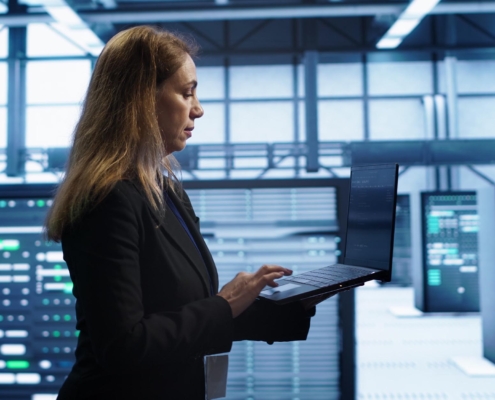 business person walking through teck facility