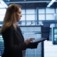 business person walking through teck facility