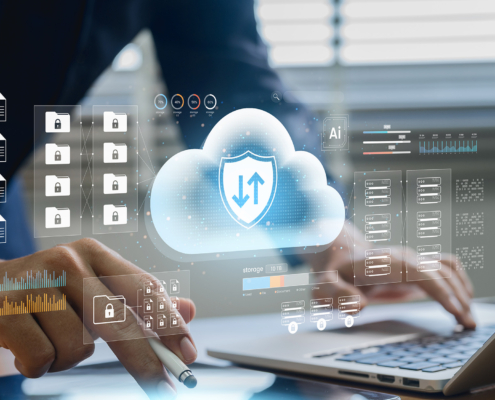 Worker using laptop connected to cloud