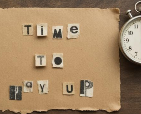 Ransom note style text reading 'Time to pay up' next to a stopwatch, representing the VMware Broadcom cost crisis.