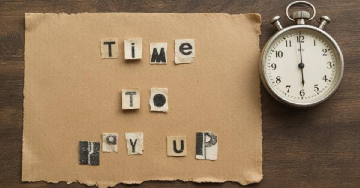 Ransom note style text reading 'Time to pay up' next to a stopwatch, representing the VMware Broadcom cost crisis.